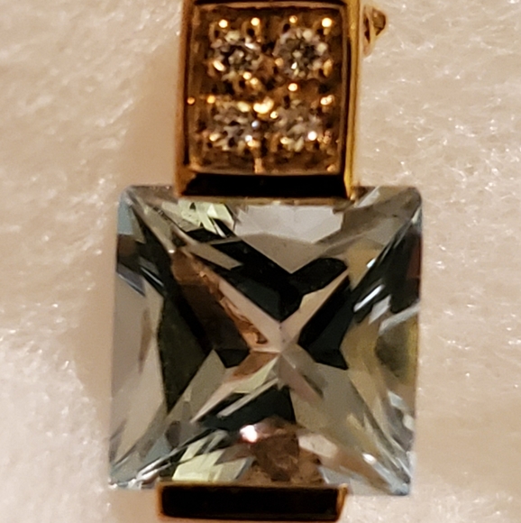 Blue Topaz and diamond gold pendant